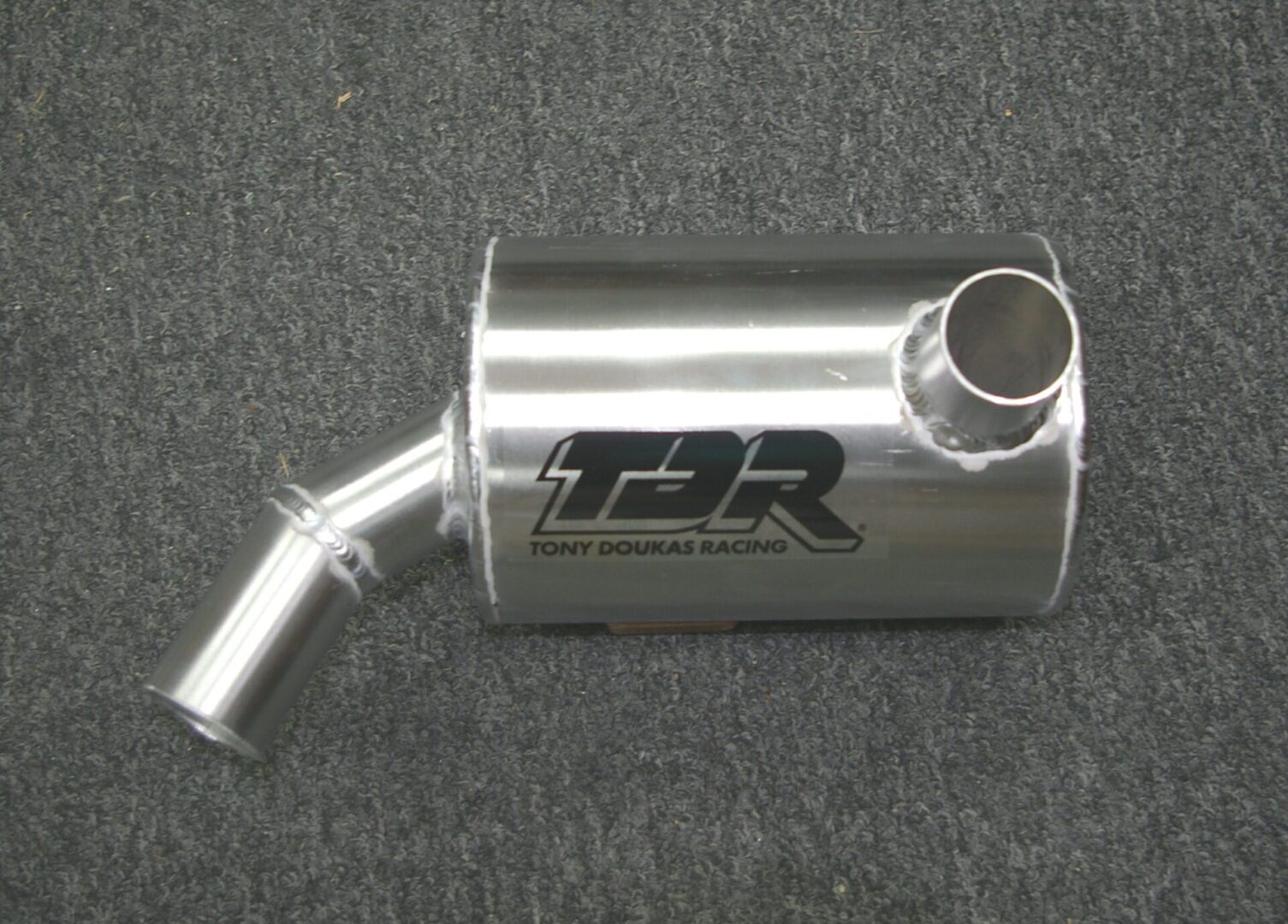 A Kaw 550 SX exhaust pipe for a car.