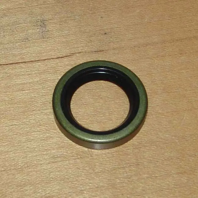 An Aftermarket Kick starter seal for Yamaha RZ 350, Banshee, sized 20x30x6mm on a wooden table.