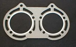 A Fiber Head Gasket 75mm for TDR Special designed for a two cylinder engine with a .160" bolt spread, Part# 15-5747.