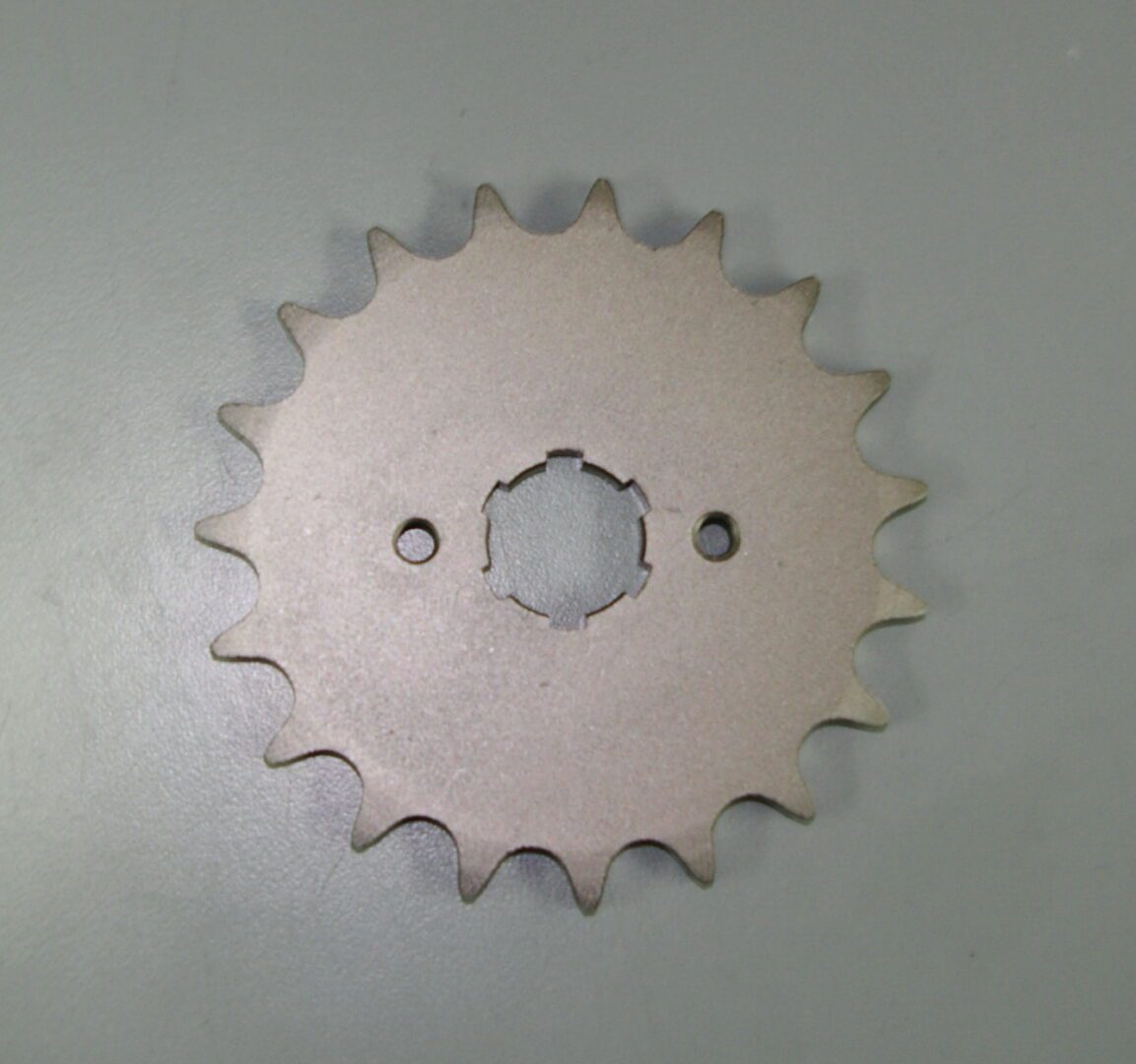 A Banshee/RZ 350 front Counter Shaft Sprocket on a white surface, part# 18-5003.