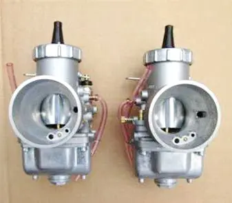 Two 36mm Mikuni Round Slide Carburetor Kits, Part 22-5735, on a cardboard box, along with a Carburetor Kit Part# 22-5735.