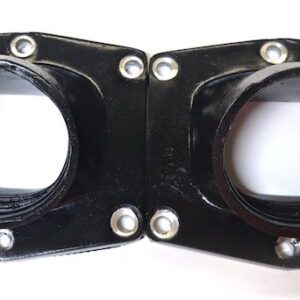 A pair of black plastic flanges on a white surface designed for the UPP Cheetah 44mm intake manifold (Part# 22-5827).