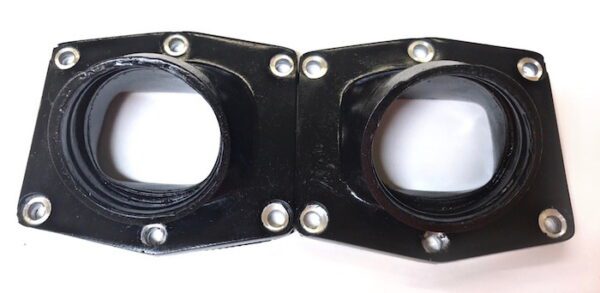 A pair of black plastic flanges on a white surface designed for the UPP Cheetah 44mm intake manifold (Part# 22-5827).