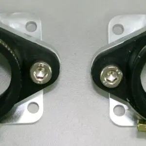 A pair of Chariot Billet intake manifold single style brackets on a white surface.