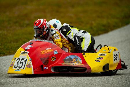 A person on a motorcycle with helmet and goggles