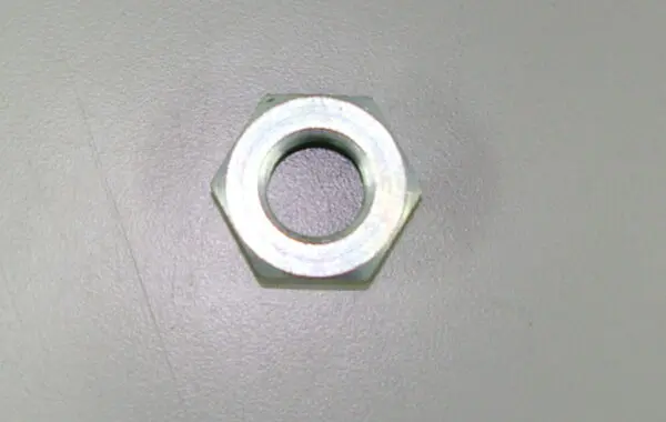 A metal nut with a hole, OEM Banshee Counter Shaft Sprocket Nut, Part# 90179-18006.