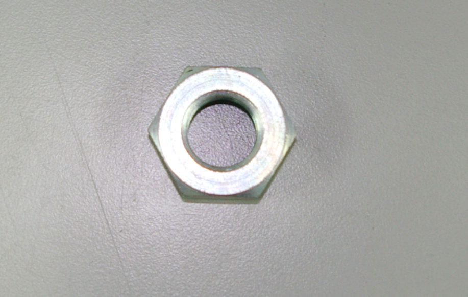 A metal nut with a hole, OEM Banshee Counter Shaft Sprocket Nut, Part# 90179-18006.