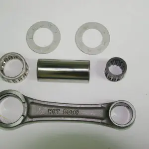 A set of metal parts including a sprocket and a HOT RODS Connecting Rod ( Long Rod ) measuring 115mm in length, Part# 91-5716.