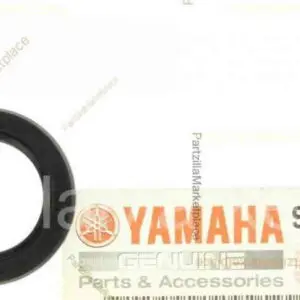 An OEM Yamaha RZ 350 Banshee Kick Start Seal, Part 93102-20484-00 New. 93101-20048, with a label on it.