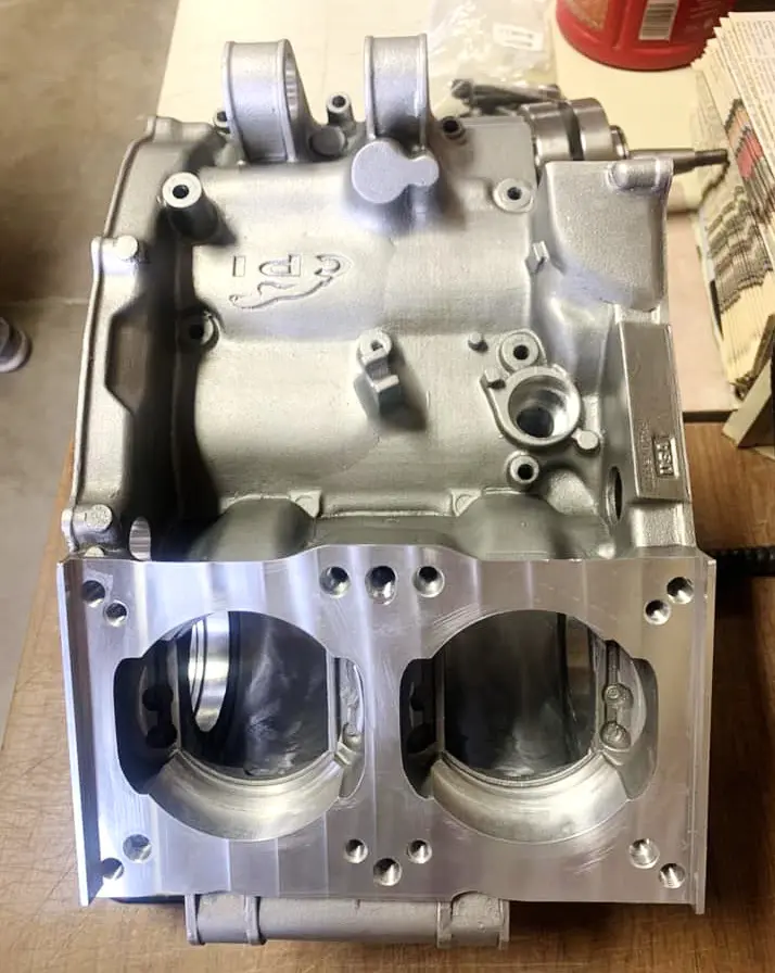 A "CP Industries Sandcast Crankcase for Yamaha RZ 350/Banshee, Part 91-5736" is sitting on top of a table.