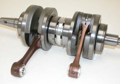 An image of a crankshaft on a white surface.